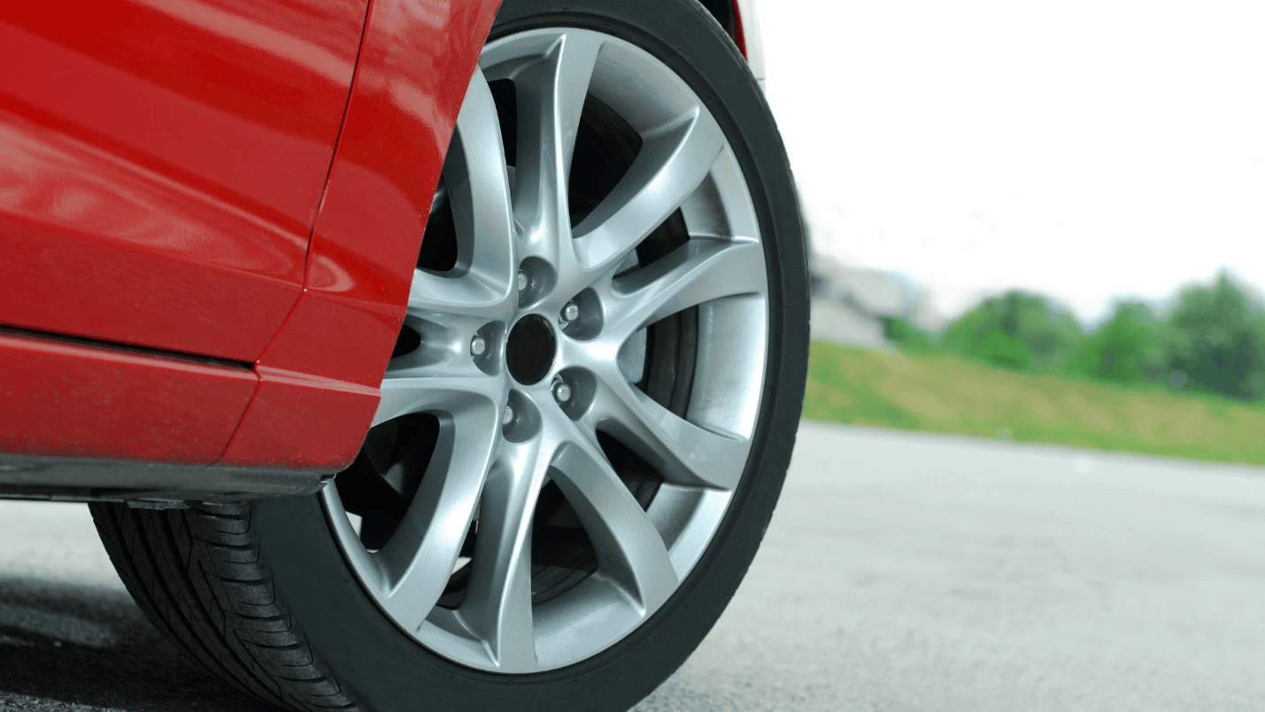 A close up image of a car’s wheel and tire as it turns to the right.